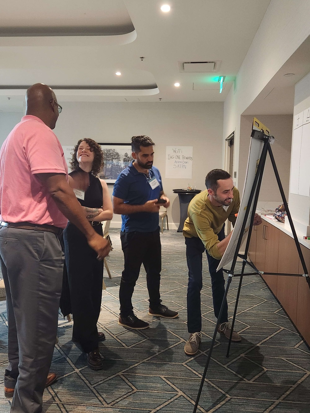 ELP Cohort 19 (Hybrid Modality) members collaborate on a leadership-versus-management Venn diagram activity during their in-person session.