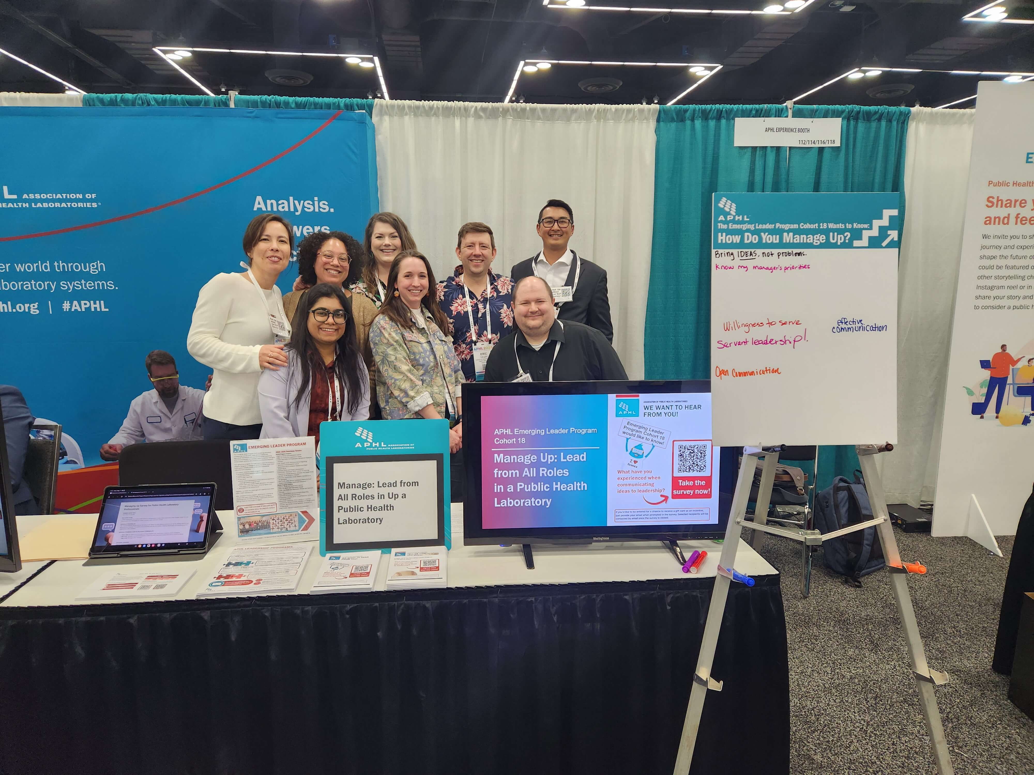 ELP Cohort 18 members gather for a group photo during the Member Experience Booth at APHL 2025 Annual Conference.