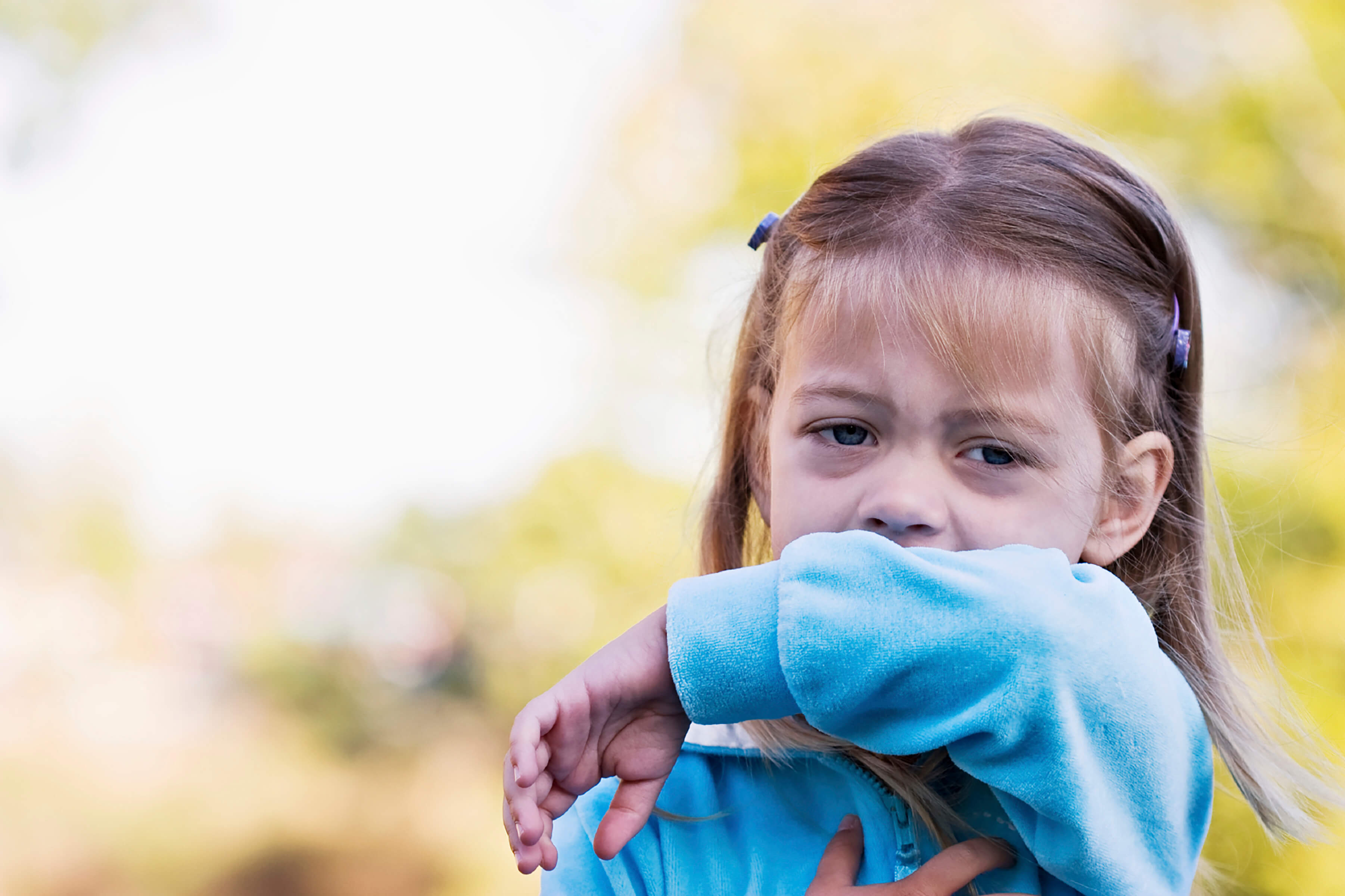 young girl coughing