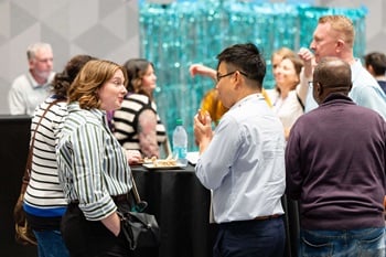 2025 Newborn Screening Symposium attendees at a conference networking event