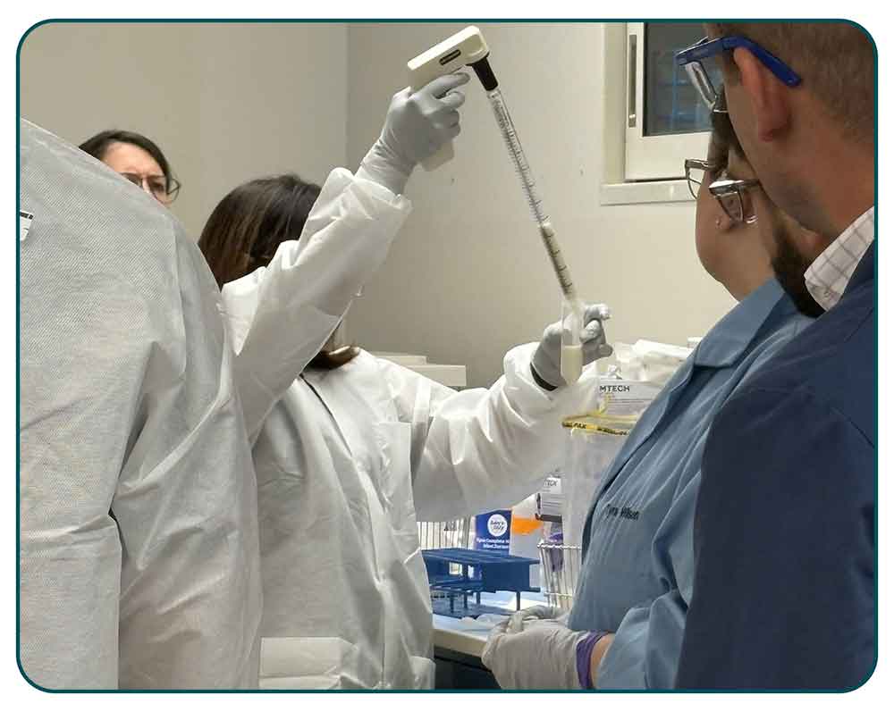 LMspring2026_22-TWD-Cronobacter-Detection_FULL An instructor demonstrates how to remove supernatants from a powdered infant formula enrichment.